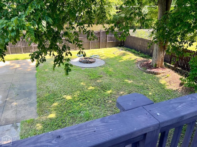 1804 Deerwood Dr, Jonesboro, AR 72404 - fenced backyard featuring an outdoor fire pit