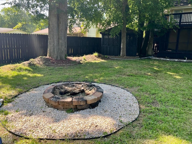 1804 Deerwood Dr, Jonesboro, AR 72404 - fenced backyard featuring a fire pit