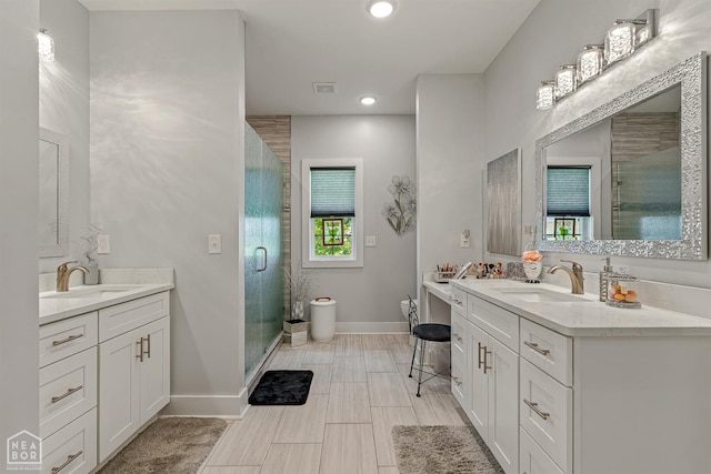 1502 S 30th St S, Paragould, AR 72450 - full bathroom with two vanities, a stall shower, baseboards, toilet, and recessed lighting