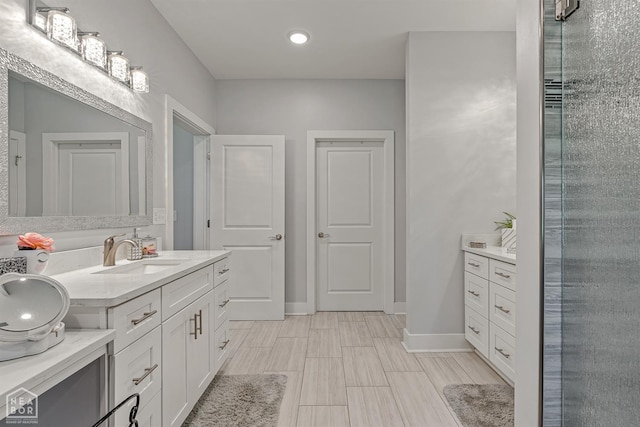 1502 S 30th St S, Paragould, AR 72450 - full bath featuring vanity, baseboards, and recessed lighting
