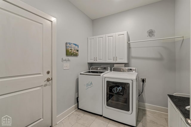 1502 S 30th St S, Paragould, AR 72450 - laundry area with light marble finish floors, baseboards, washing machine and dryer, and cabinet space