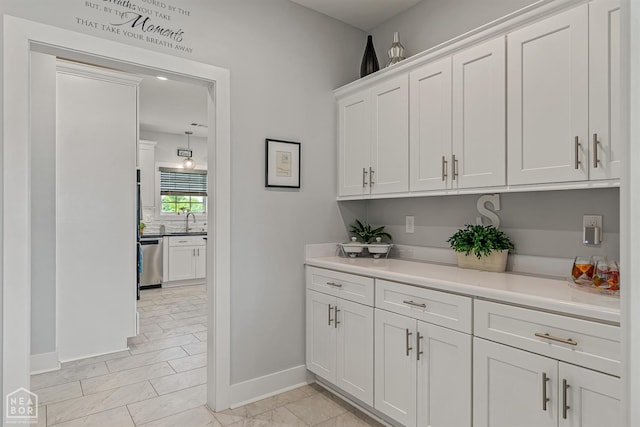 1502 S 30th St S, Paragould, AR 72450 - bar featuring dishwasher, baseboards, and a sink