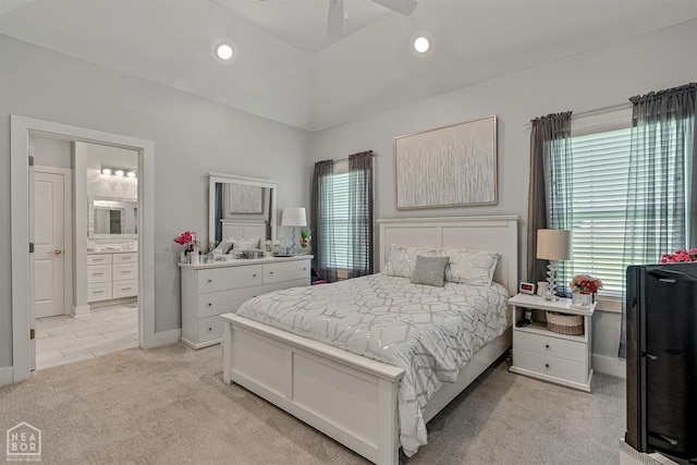 1502 S 30th St S, Paragould, AR 72450 - bedroom with light colored carpet, lofted ceiling, baseboards, connected bathroom, and recessed lighting