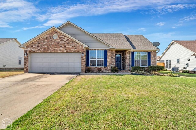 301 Natchez Dr, Jonesboro, AR 72404 - single story home featuring a garage, cooling unit, a front yard, brick siding, and driveway