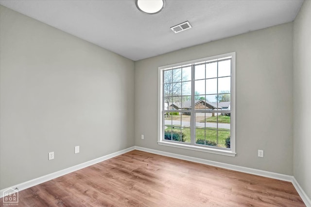 301 Natchez Dr, Jonesboro, AR 72404 - unfurnished room with wood finished floors, baseboards, and visible vents