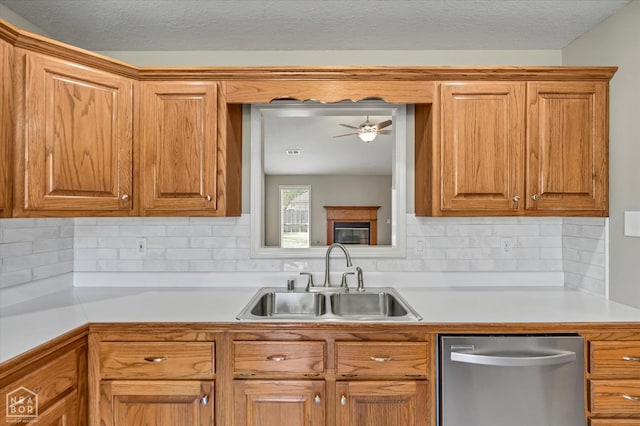301 Natchez Dr, Jonesboro, AR 72404 - kitchen with stainless steel dishwasher, light countertops, a sink, and decorative backsplash