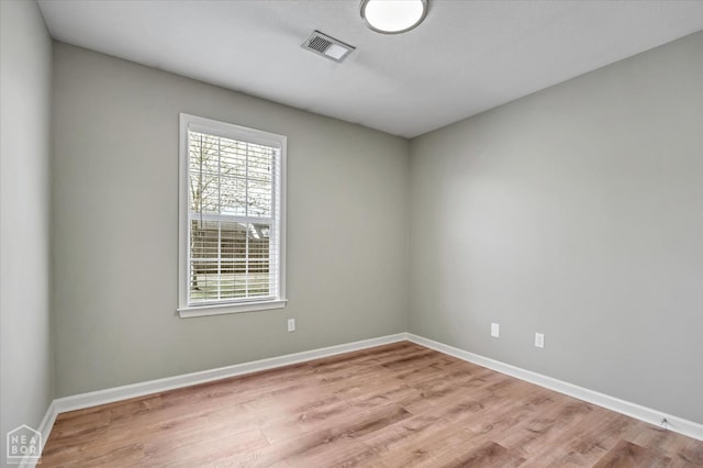 301 Natchez Dr, Jonesboro, AR 72404 - unfurnished room with visible vents, baseboards, and light wood finished floors