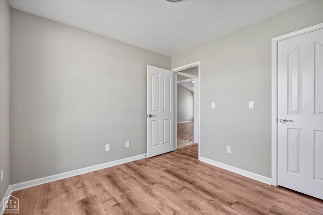 301 Natchez Dr, Jonesboro, AR 72404 - unfurnished bedroom with light wood finished floors and baseboards
