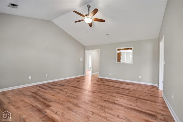 301 Natchez Dr, Jonesboro, AR 72404 - empty room with ceiling fan, light wood-style flooring, visible vents, vaulted ceiling, and baseboards