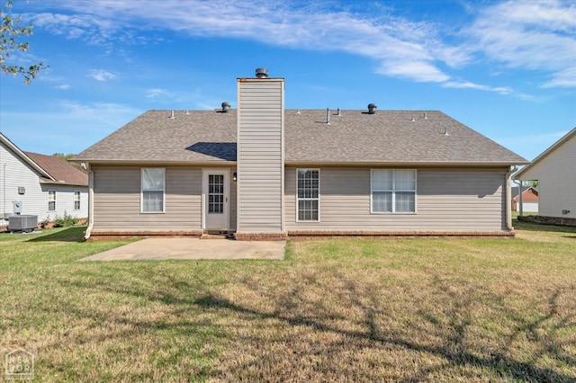 301 Natchez Dr, Jonesboro, AR 72404 - back of property with central AC unit, a lawn, a chimney, a patio, and roof with shingles