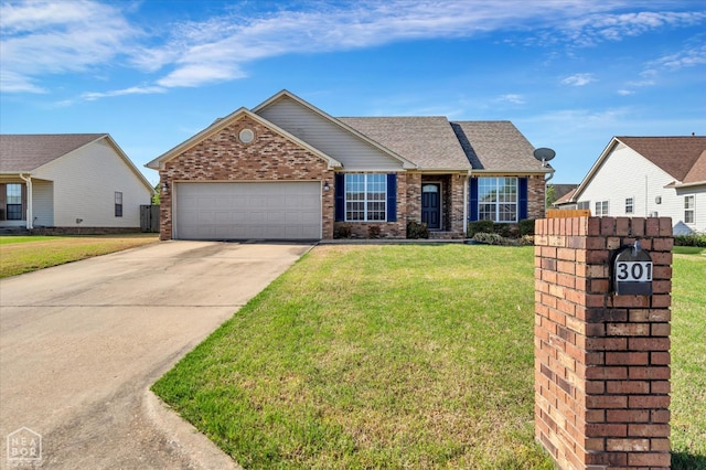 301 Natchez Dr, Jonesboro, AR 72404 - view of front of home with concrete driveway, brick siding, a garage, and a front lawn