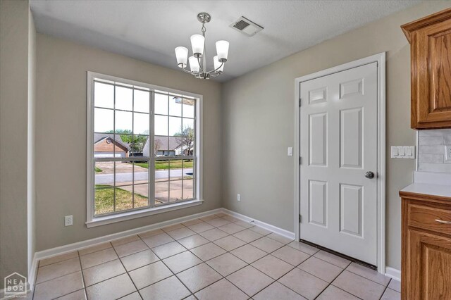 301 Natchez Dr, Jonesboro, AR 72404 - unfurnished dining area featuring visible vents, baseboards, an inviting chandelier, and light tile patterned floors