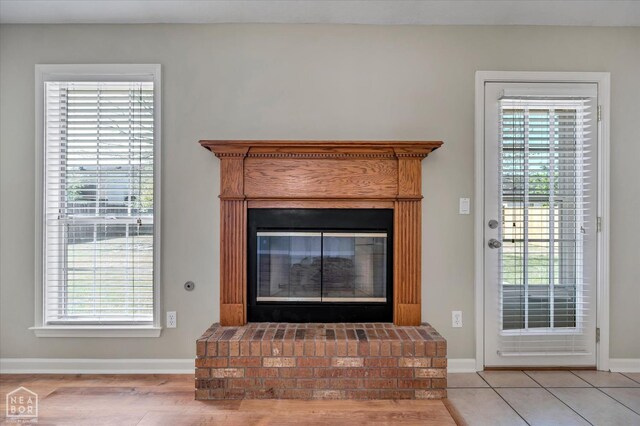 301 Natchez Dr, Jonesboro, AR 72404 - details featuring baseboards and a brick fireplace
