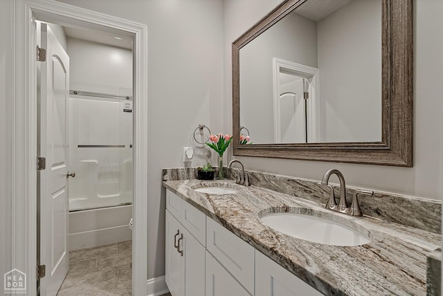 6605 Evan Cv, Jonesboro, AR 72404 - full bathroom with double vanity and enclosed tub / shower combo