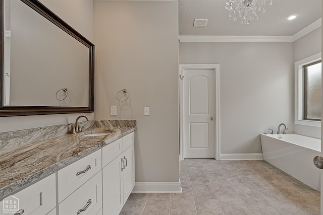 6605 Evan Cv, Jonesboro, AR 72404 - full bath with crown molding, vanity, a tub, baseboards, and a chandelier