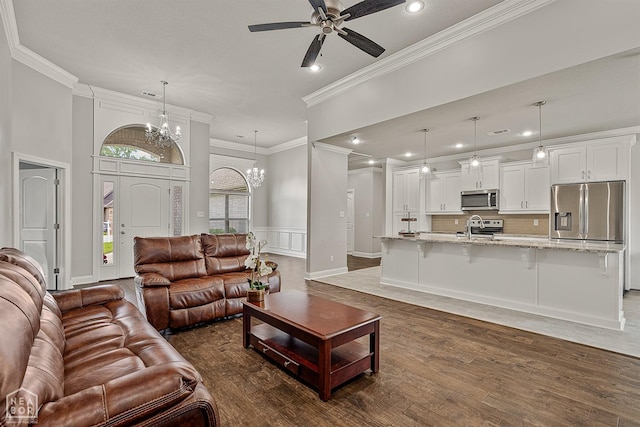 6605 Evan Cv, Jonesboro, AR 72404 - living room with recessed lighting, wood finished floors, crown molding, a chandelier, and ceiling fan