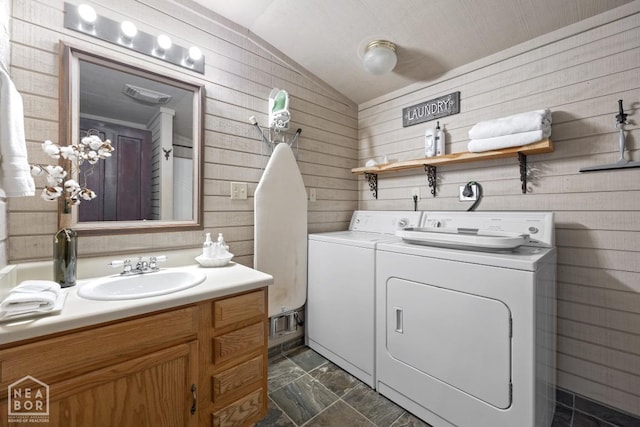 2 Star Falls Ln, Cherokee Village, AR 72529 - clothes washing area with wooden walls, separate washer and dryer, laundry area, and a sink