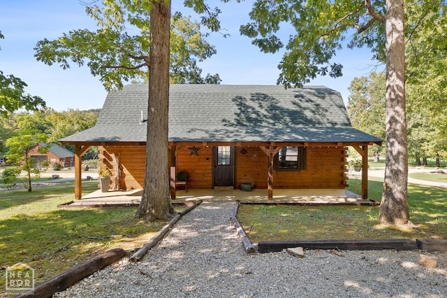 2 Star Falls Ln, Cherokee Village, AR 72529 - log home featuring log exterior, a front lawn, a shingled roof, and a patio area