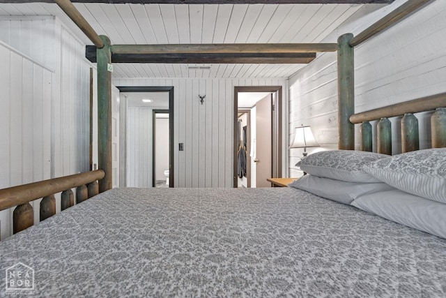 2 Star Falls Ln, Cherokee Village, AR 72529 - bedroom featuring wood walls and beam ceiling