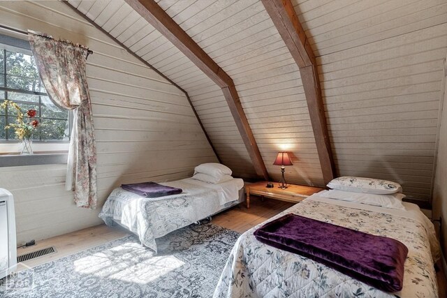 2 Star Falls Ln, Cherokee Village, AR 72529 - unfurnished bedroom featuring wood walls, visible vents, wood ceiling, vaulted ceiling with beams, and wood finished floors