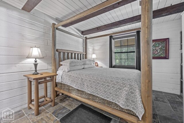 2 Star Falls Ln, Cherokee Village, AR 72529 - bedroom featuring wood ceiling, stone tile floors, wood walls, and beamed ceiling
