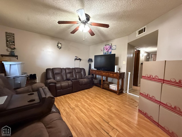 500 Oak St, Trumann, AR 72472 - living area featuring ceiling fan, a textured ceiling, and light wood finished floors