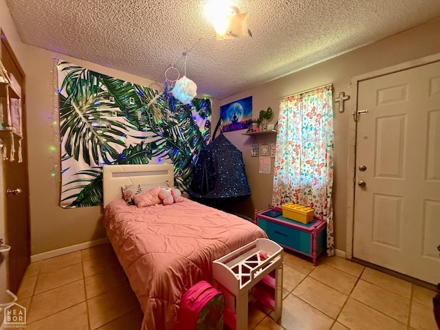 500 Oak St, Trumann, AR 72472 - bedroom featuring a textured ceiling and light tile patterned floors
