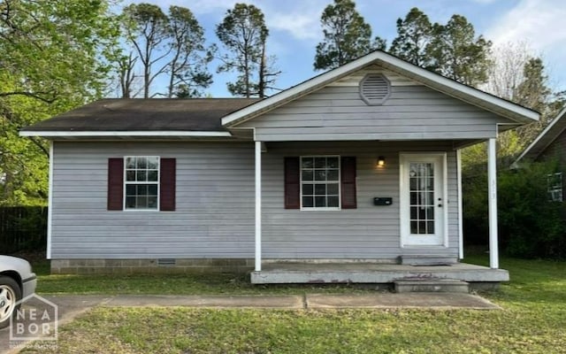 313 Olive St, Trumann, AR 72472 - view of front of property with a front yard, crawl space, and a porch