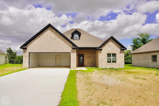 99 Rivercrest, Jonesboro, AR 72417 - view of front facade featuring brick siding, driveway, an attached garage, and a shingled roof