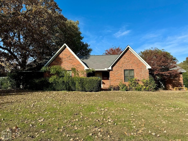 3426 Aggie Rd, Jonesboro, AR 72405 - view of front facade featuring brick siding and a front lawn