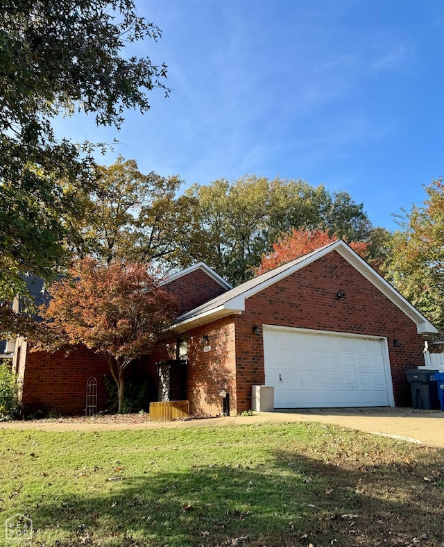 3426 Aggie Rd, Jonesboro, AR 72405 - view of front of home featuring a garage, brick siding, and a front lawn