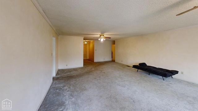 819 Northgate Dr, Osceola, AR 72370 - unfurnished living room featuring carpet, a textured ceiling, and a ceiling fan
