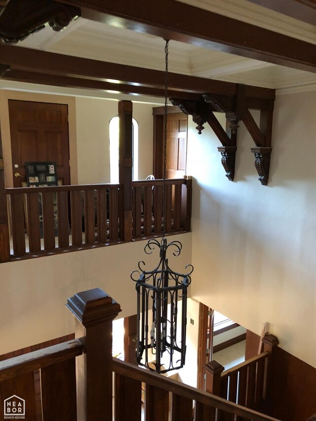  - interior details featuring an inviting chandelier