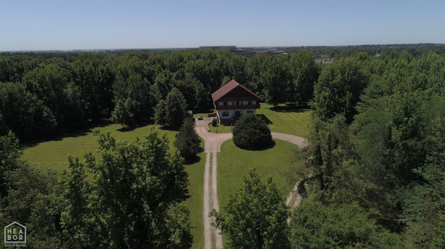  - drone / aerial view with a wooded view