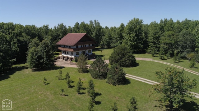  - drone / aerial view with a wooded view