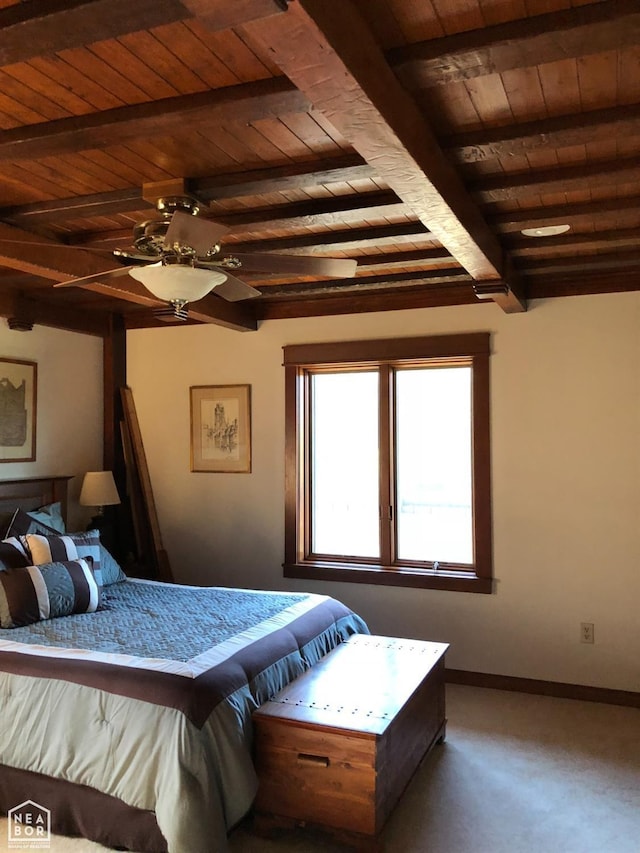  - bedroom with carpet flooring, baseboards, wooden ceiling, and beam ceiling