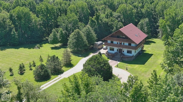  - drone / aerial view with a wooded view