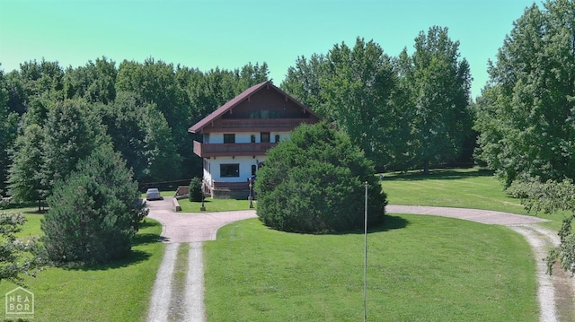  - surrounding community featuring driveway and a lawn