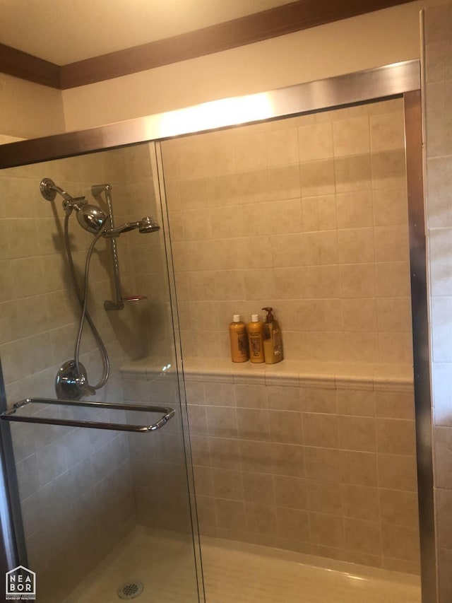  - full bathroom with a shower stall
