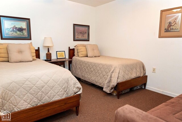  - carpeted bedroom featuring baseboards
