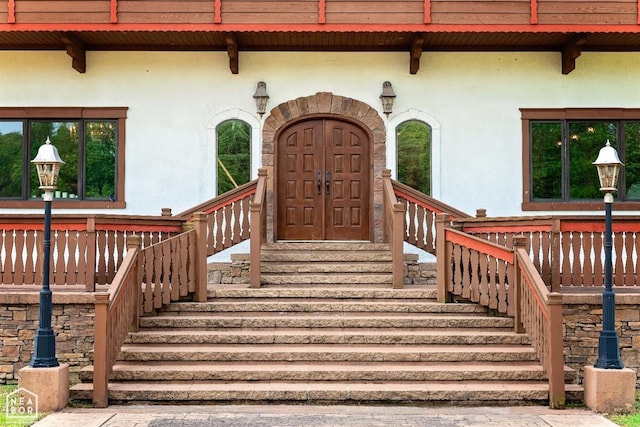  - view of exterior entry with stucco siding