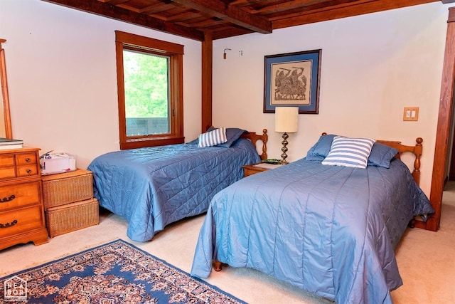  - carpeted bedroom featuring wood ceiling and beamed ceiling