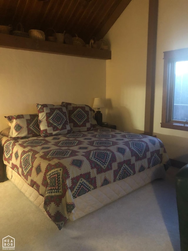  - bedroom featuring carpet and lofted ceiling