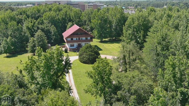  - bird's eye view featuring a wooded view
