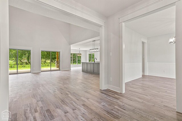 interior space with an inviting chandelier and wood finished floors