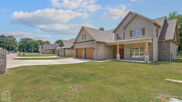 view of front of property with driveway, board and batten siding, a front lawn, brick siding, and a garage