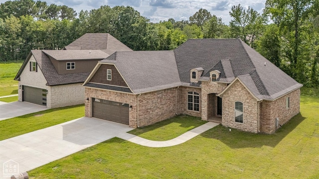 french country inspired facade featuring a front yard, stone siding, a garage, and roof with shingles