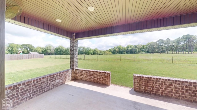 118 E Hills Dr, Bono, AR 72416 - fenced backyard with a patio, a view of rural / pastoral area, and view of scattered trees