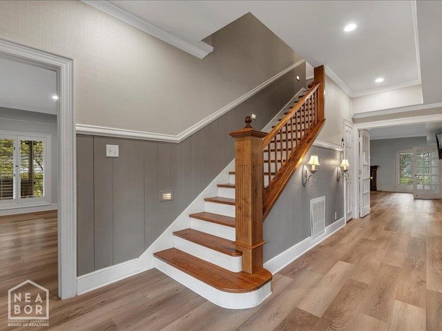 1005 Fairway, Jonesboro, AR 72401 - stairs featuring ornamental molding, plenty of natural light, wood finished floors, recessed lighting, and baseboards