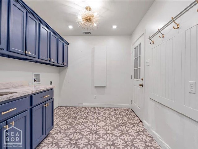1005 Fairway, Jonesboro, AR 72401 - washroom featuring hookup for an electric dryer, hookup for a washing machine, light flooring, cabinet space, and baseboards